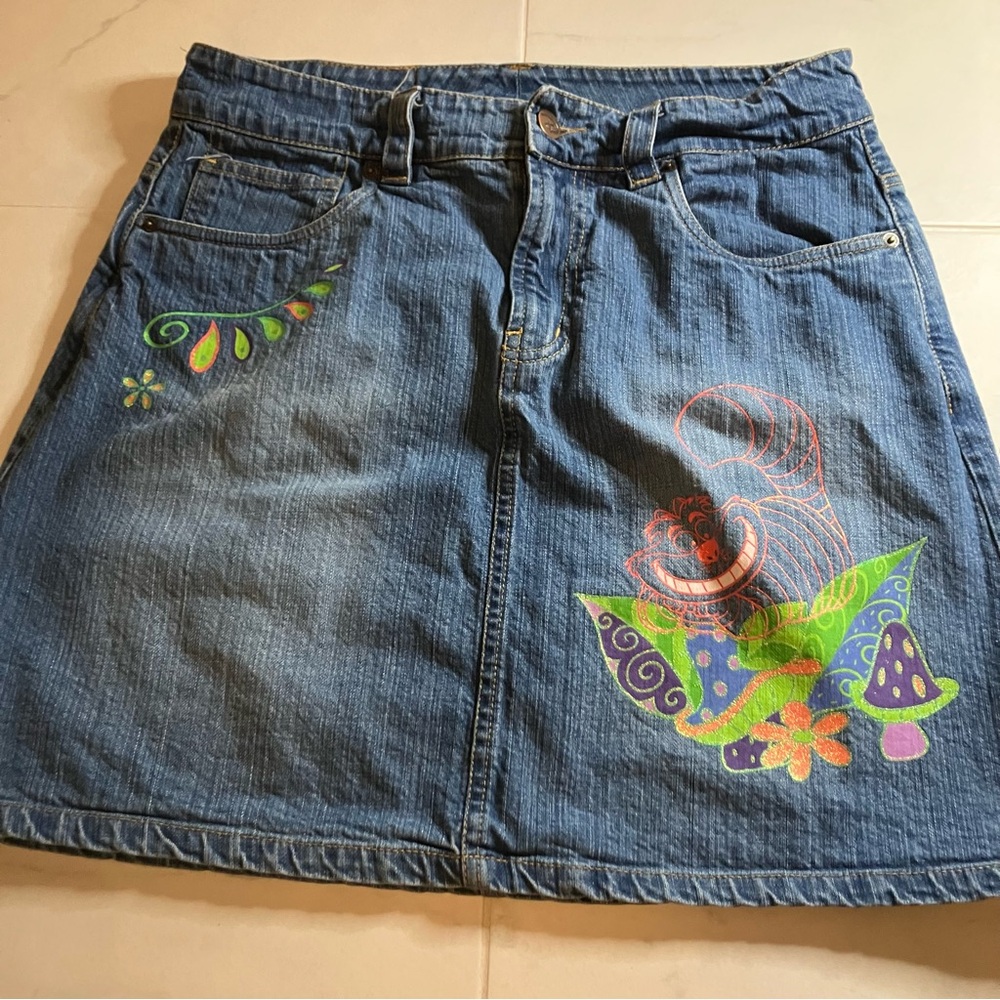 Disney blue Denim Jean Skirt with Colorful Alice in Wonderland Cheshire Cat. EUC